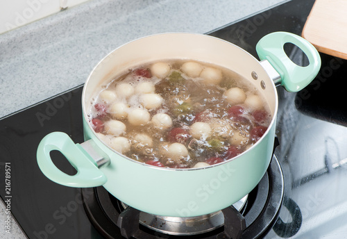 The cooking step of making Japanese Dango dessert with 3 different color in pink(red), white, and green, recipe, hanami Dango, tsukimi Dango, copy space photo