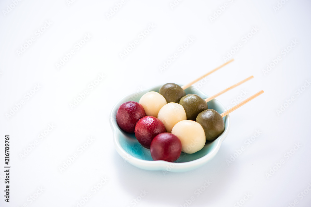 Japanese Dango dessert with 3 different color in pink(red), white, and green, recipe, hanami Dango, tsukimi Dango, copy space. Japanese Dango dessert with 3 different color in pink(red), white, and green, recipe, hanami Dango, tsukimi Dango, copy space.