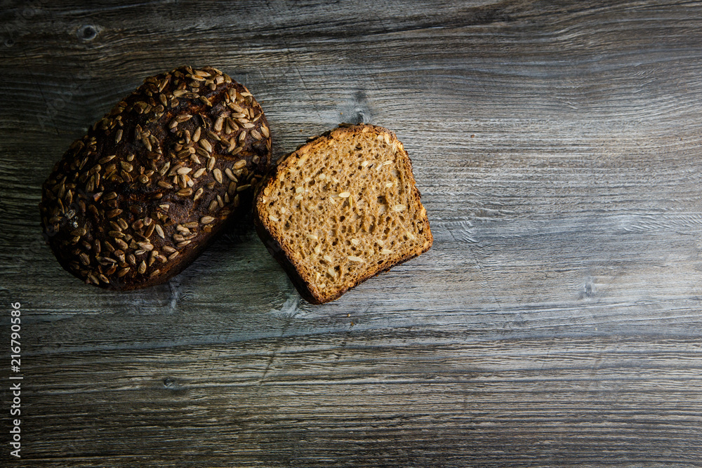 whole and half of handmade rectangular rye bread whole and half of handmade rectangular rye bread