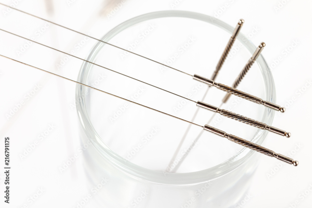 Silver needles for traditional Chinese medicine acupuncture. Close-up. White background. Silver needles for traditional Chinese medicine acupuncture. Close-up. White background.