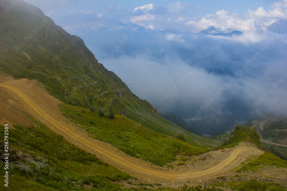 Mountain road high in clouds in the mountains  of Sochi, Russia, August 22, 2017