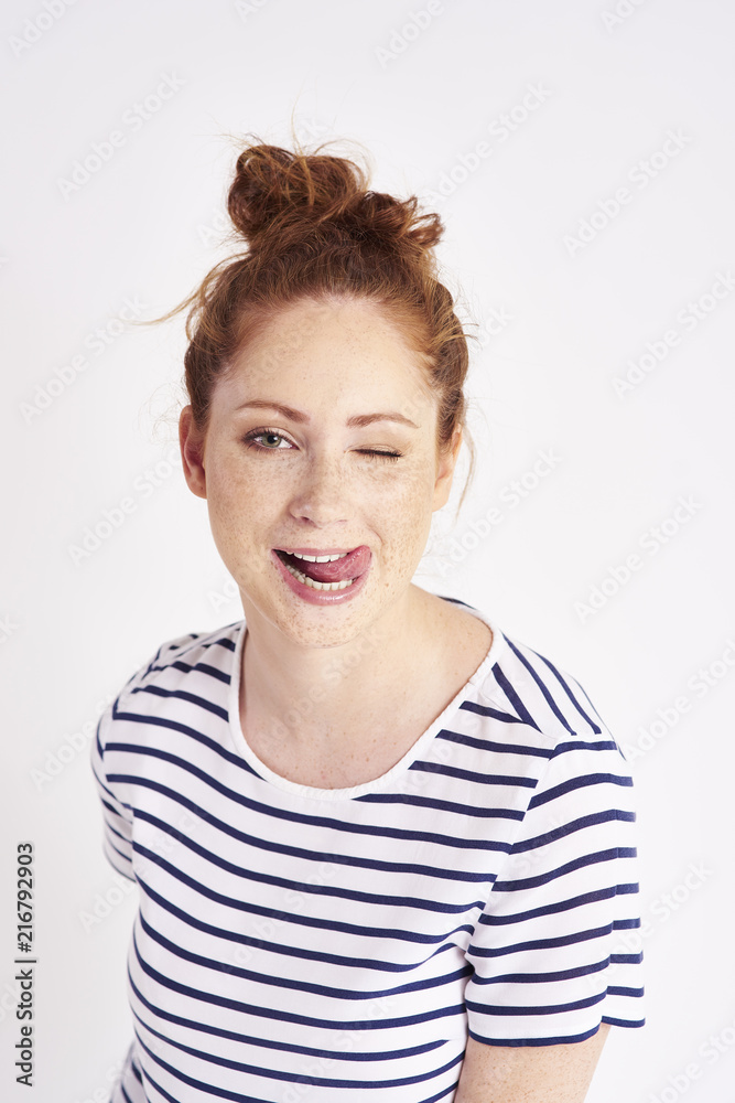 Portrait of girl licking her lips at studio shot Portrait of girl licking her lips at studio shot