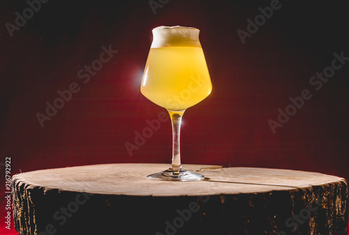 Wood Barrel Aged Lambic Beer in Teku Glass. photo
