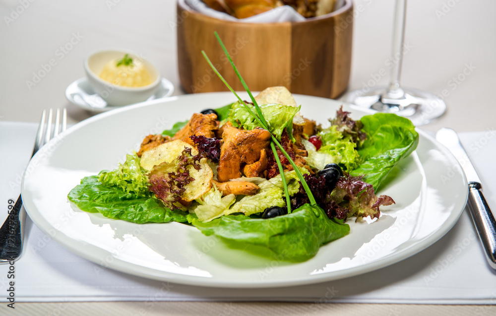 Garden fresh leaf salad with forest mushrooms, and berries