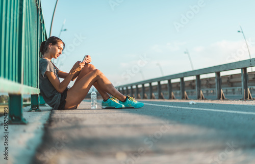 Woman with mobile phone, sport and workout