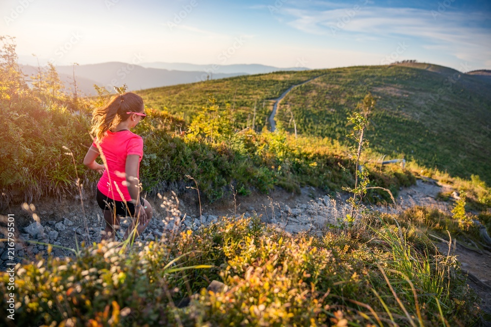 Beautiful young woman running in mountains. Beautiful young woman running in mountains.
