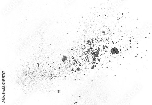 Black powder explosion, charcoal dust texture isolated on white background photo