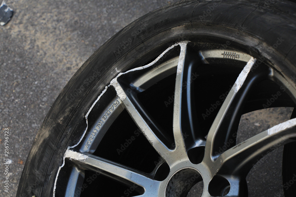 Car wheel and tire damaged