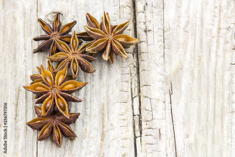 Fototapeta premium star anise on wooden background