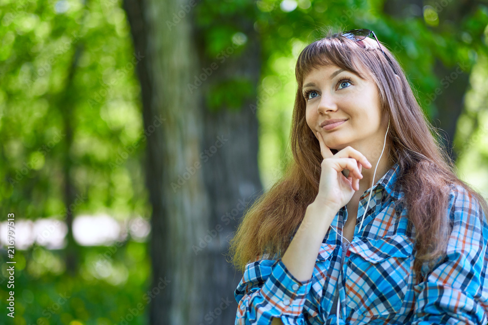 Summer girl portrait. Asian woman smiling happy on sunny summer or spring day outside in park. Pretty young woman outdoors. Summer girl portrait. Asian woman smiling happy on sunny summer or spring day outside in park. Pretty young woman outdoors.