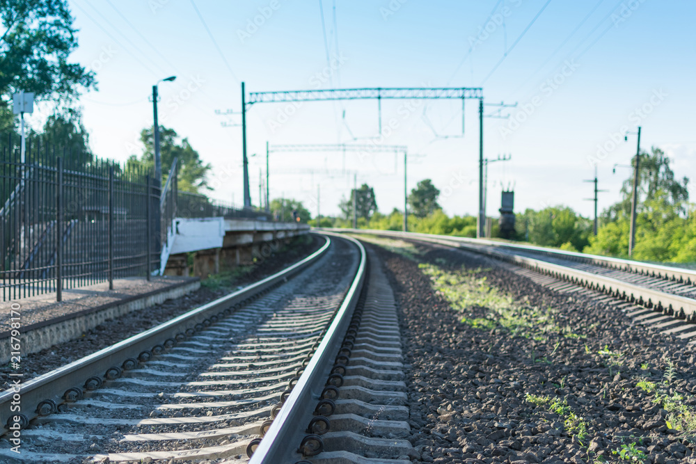 Railway rails leaving into the distance.