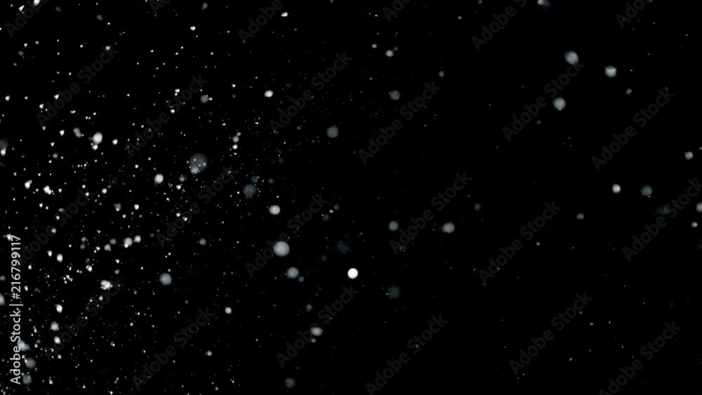 Super slow motion of water drops on black background. Filmed on high speed cinema camera, 1000 fps. Super slow motion of water drops on black background. Filmed on high speed cinema camera, 1000 fps.