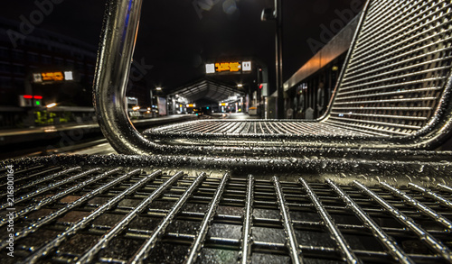 Modern metal seats covered with water drops. Hamburg subway station at rainy day. 