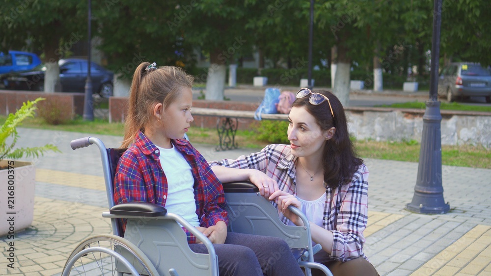 Teenager disabled in a wheelchair talking to a girl Stock Photo | Adobe ...