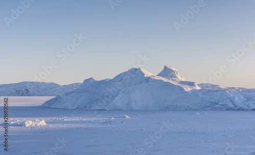Sunset over the Kangia icefjord in west Greenland photo
