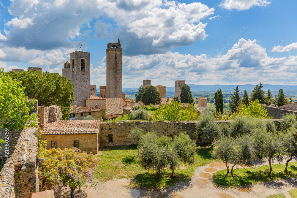 Cityscape of San Gimignano with the Courtyard of the ancient fortress ruin in Italy