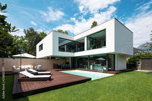 Exterior modern white villa with pool and garden © alexandre zveiger