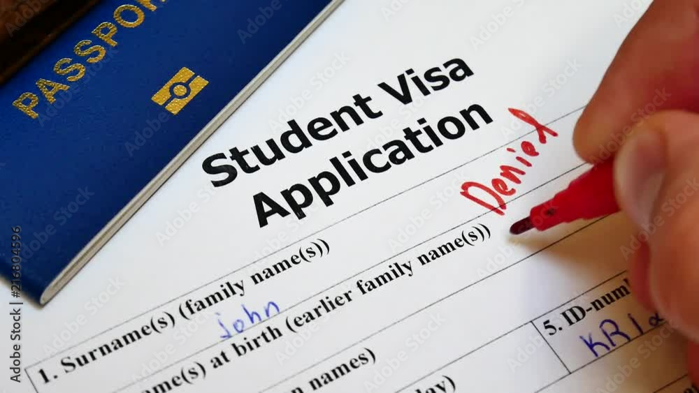 The decision to grant a visa. Pen voting denied in checkbox in blank Student Visa application form with passport and pen. Document with passport, apply and permission for foreigner country