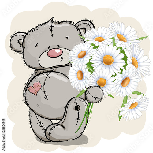Teddy bear and a bouquet of white chamomile