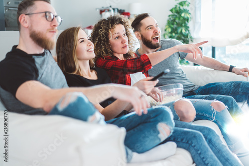 Four friends watching tv