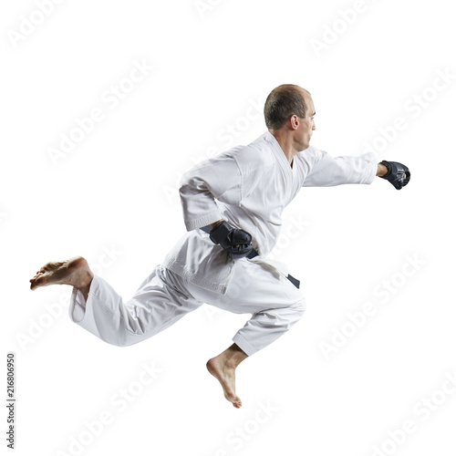 A man in black gloves beats with a hand in a jump isolated