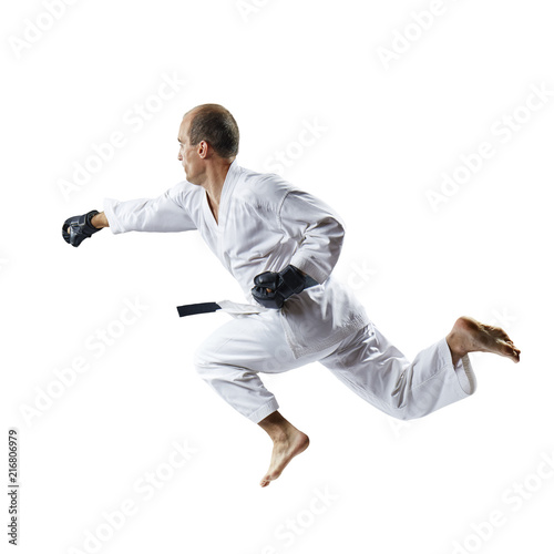 Athlete in black gloves beats with a hand in a jump isolated