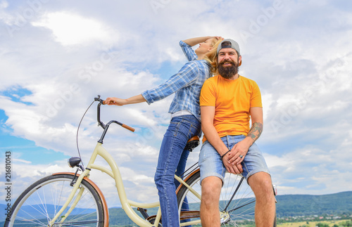 Bike rental or bike hire for short periods of time. Date ideas. Couple with bicycle romantic date sky background. Man and woman rent bike to discover city. Couple in love date outdoors cycling