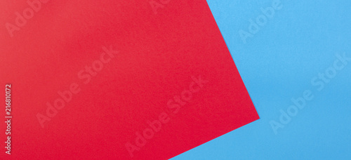 Color papers geometry flat composition background with red and blue tones