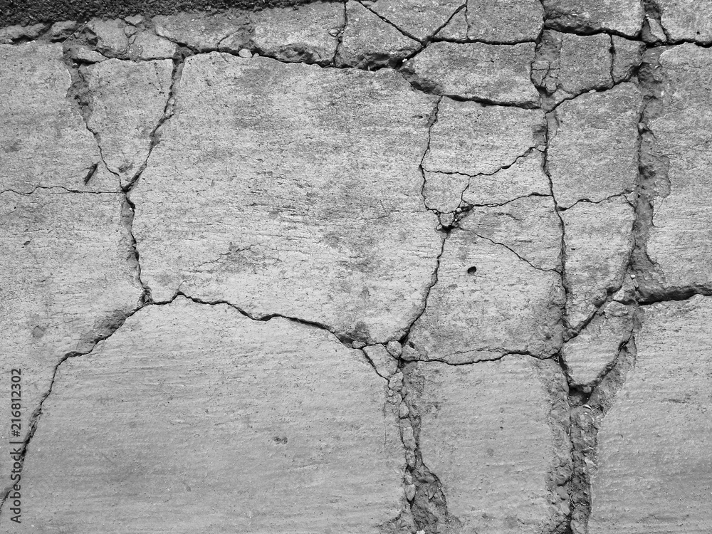 Cracked concrete texture closeup background Cracked concrete texture closeup background