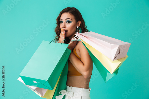 Fotografija Photo of shopaholic girl 20s wearing fashion style holding colorful paper shoppi