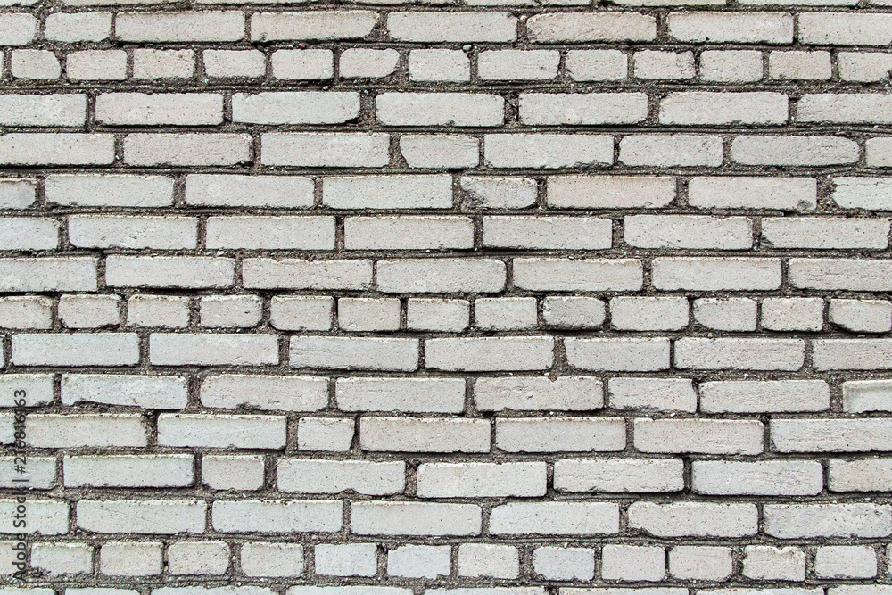 building construction: white brick wall texture - stained bricks bonded with cement building construction: white brick wall texture - stained bricks bonded with cement