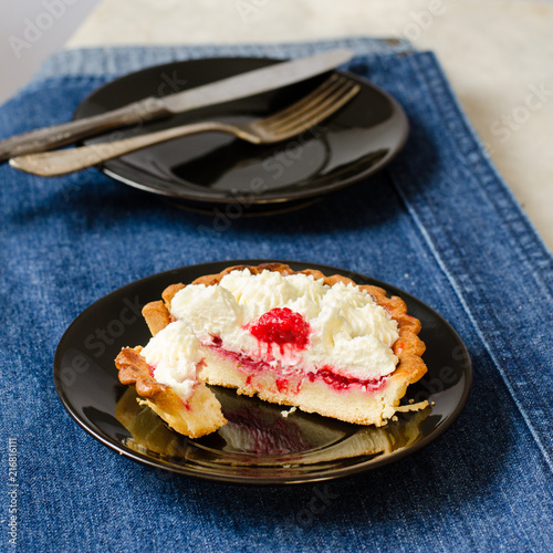 Raspberry tartlets with cream filling photo