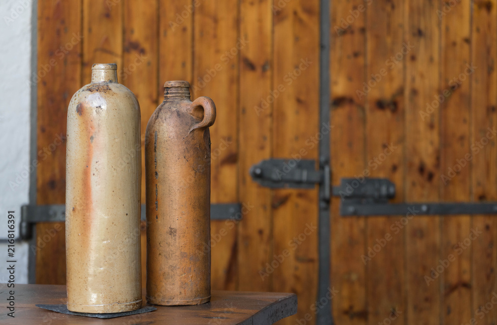 old vases in front of a rustic background