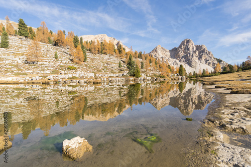 Fanes lake in Dolomites with autumnal coulors. Fanes valley, Badia Valley, Trentino, Italy. photo