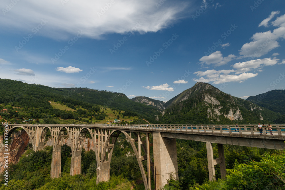 bridge, canyon, architecture, landscape, sky, old, road, arch, stone, nature, travel, aqueduct, europe, mountain, montenegro, ancient, view, green, landmark, construction, tourism