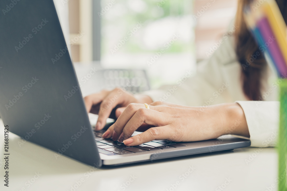 Close Up of business woman hands working on laptop computer. Close Up of business woman hands working on laptop computer.