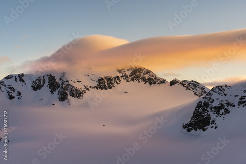 Red cloud at sunrise over Palon de la Mare. Santa Caterina Valfurva, Sondrio district, Lombardy, Italy