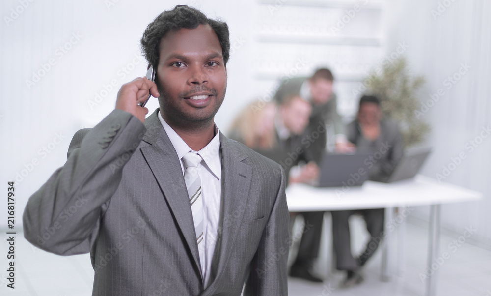 portrait of a successful employee with a mobile phone portrait of a successful employee with a mobile phone
