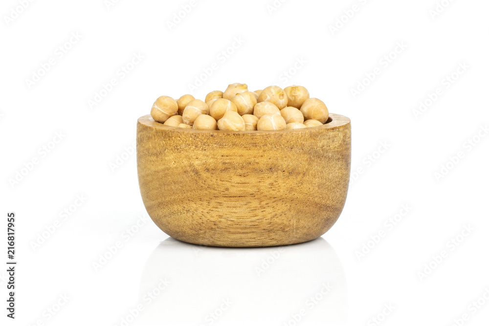 Lot of whole raw chickpeas kabuli variety with wooden bowl isolated on white background Lot of whole raw chickpeas kabuli variety with wooden bowl isolated on white background