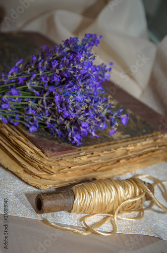 Fototapeta Naklejka Na Ścianę i Meble -  Vintage composition with lavender, old book and rustic twine
