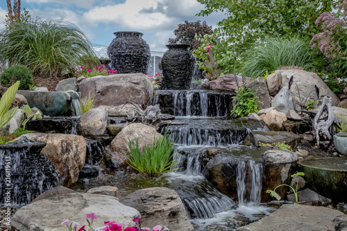 Fotografi Landscape architecture with waterfall features for summer garden