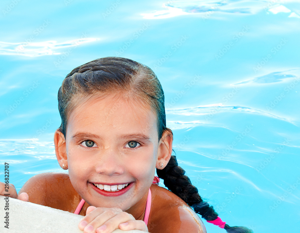 Cute smiling happy little girl child in swimming pool Stock Photo ...