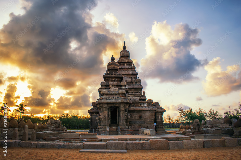 Photo shot on sunrise time where the historical buildings of Mamallapuram monuments are highlighted. 