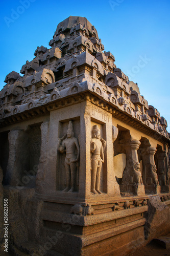 Photo shot on sunrise time where the historical buildings of Mamallapuram monuments are highlighted.  photo