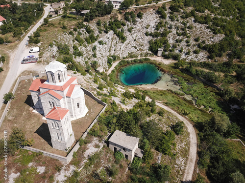 The spring of the Cetina River (izvor Cetine) in the foothills of the Dinara Mountain is named Blue Eye (Modro oko). Cristal clear waters emerge on the surface from a more than 100 meter-deep cave. photo