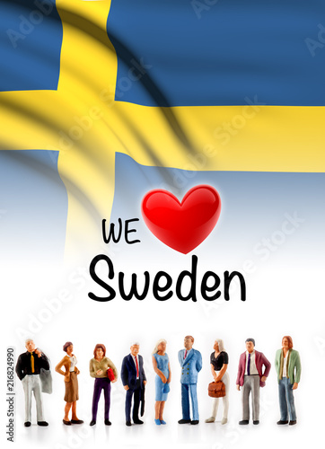 Obraz na plátně we love Sweden, A group of people pose next to the swedish flag