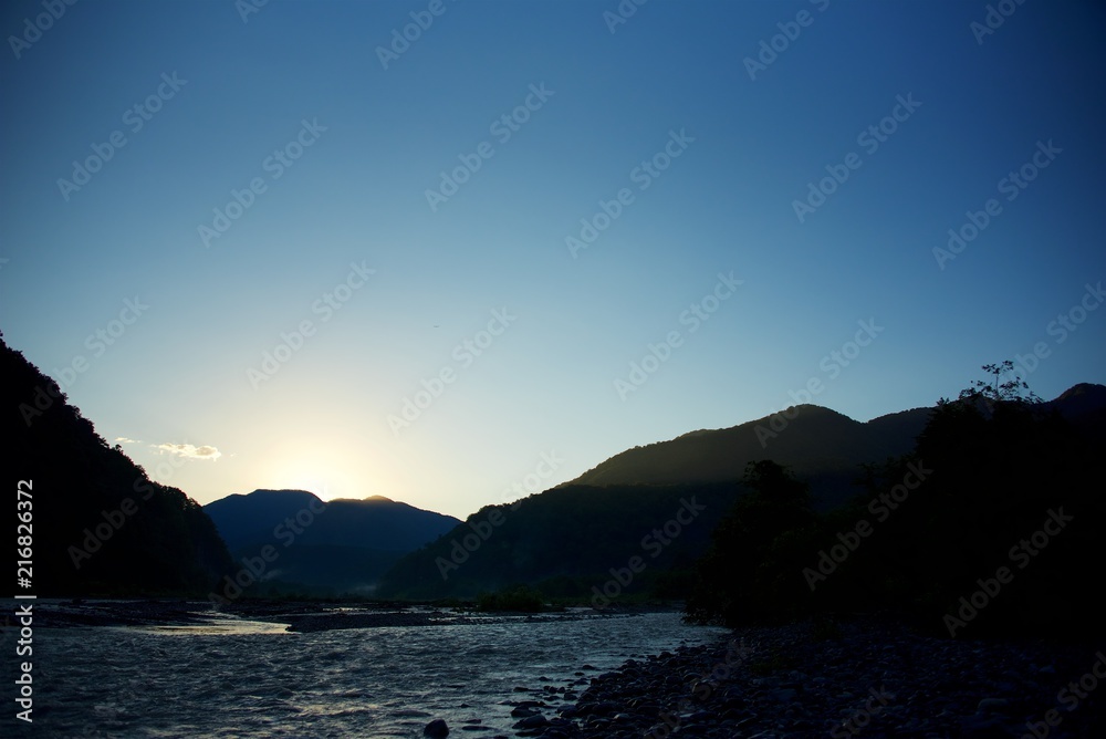 Dawn in the mountains by the river