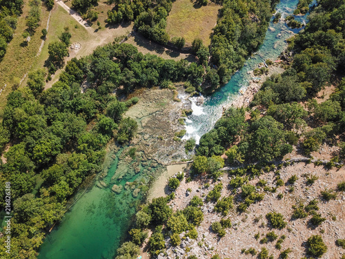 Zrmanja River in northern Dalmatia, Croatia is famous for its crystal clear waters and countless waterfalls surrounded by a deep canyon.