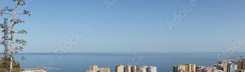 Spain, Malaga, a large body of water with a city in the background
