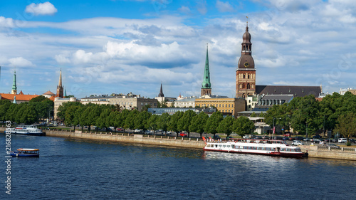 Panoramic view across Daugava river with cruise chip and Riga cathedral in old town, Latvia, July 25, 2018
